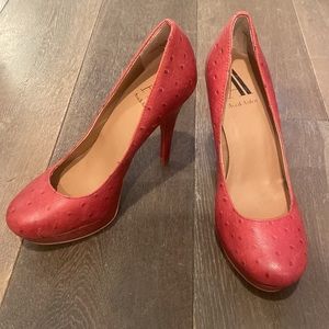 Red ostrich print platform pumps